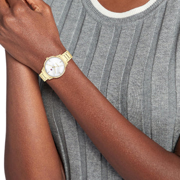 Γυναικείο ρολόι Tommy Hilfiger Paige 1782546 με χρυσό ατσάλινο μπρασελέ και άσπρο φίλντισι καντράν διαμέτρου 36mm με ζιργκόν.